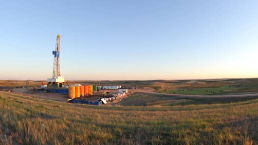 An oil drilling rig is seen drilled into the Bakken Formation, one of the largest contiguous deposits of oil and natural gas in the United States.